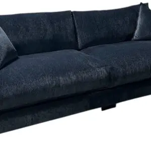 Plush dark blue velvet sofa with cushions
