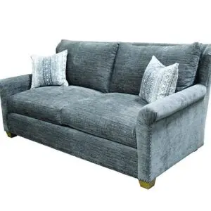 Blue-gray upholstered sofa with two pillows