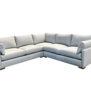 Light gray L-shaped sectional sofa with pillows