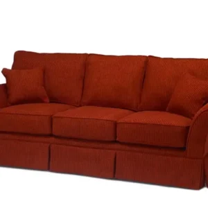 Red upholstered three-seater sofa with cushion