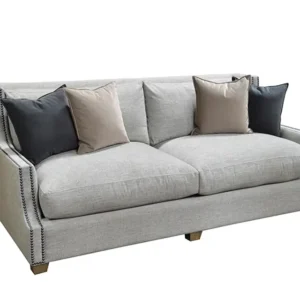 Light gray upholstered sofa with throw pillows
