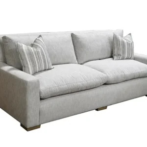 Light gray modern sofa with striped pillows