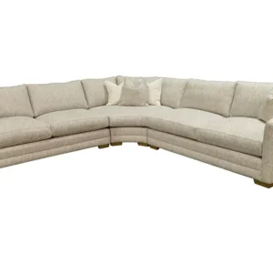 Beige curved sectional sofa with throw pillows