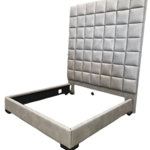 Upholstered gray platform bed with tufted headboard